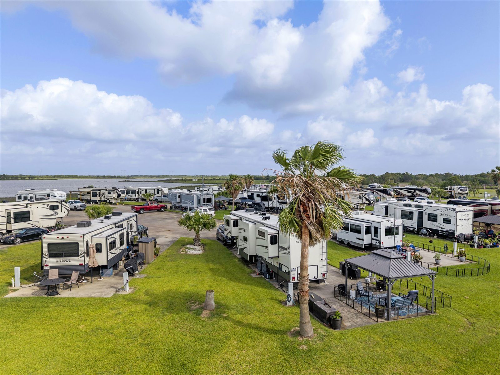Spacious 40' and 60' Concrete RV Sites with Full Pedestals on Dickinson Bayou